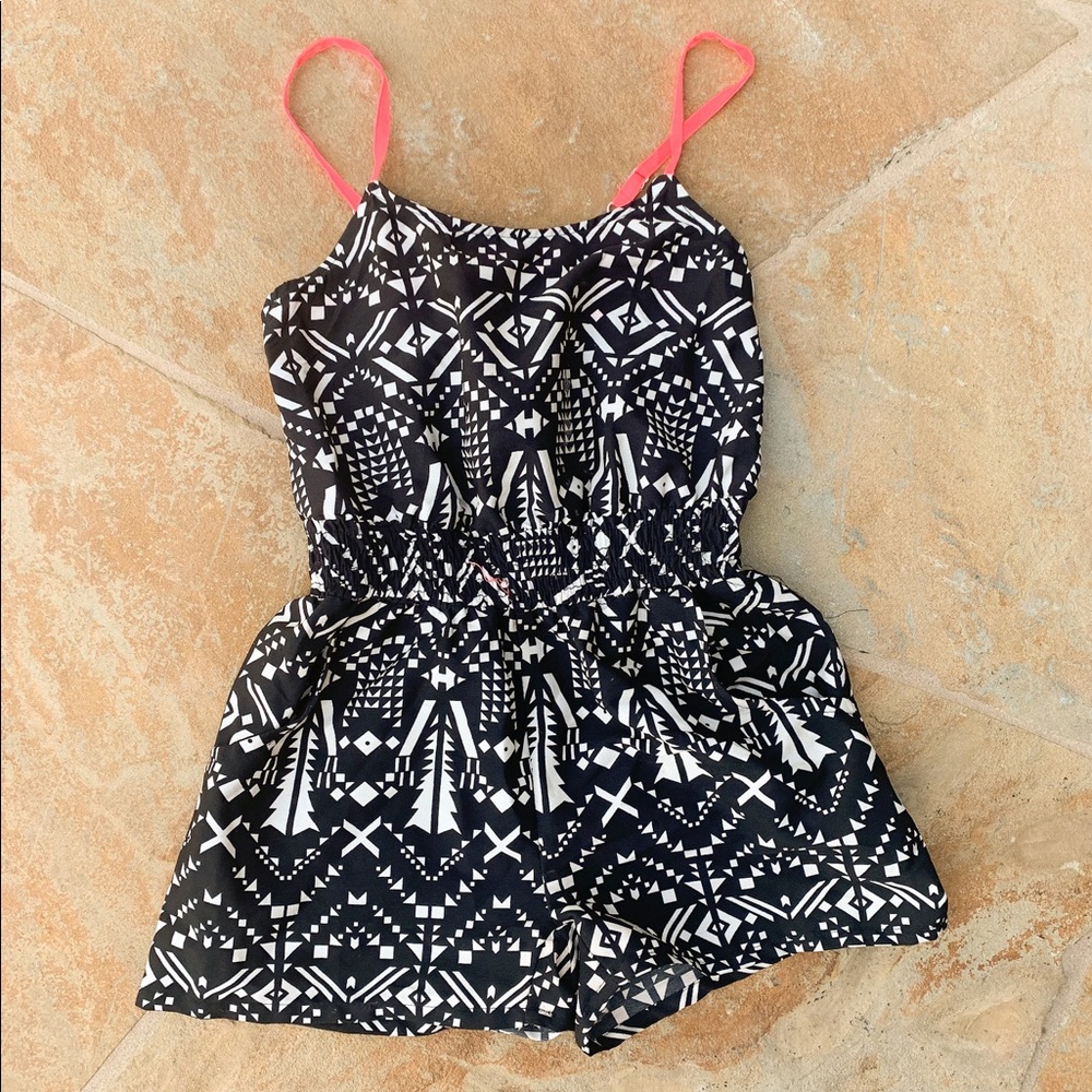 Black, white, with pink straps romper.